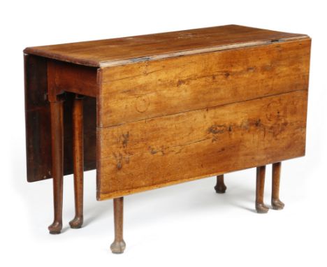 A George II yew drop-leaf dining table, on twin-gate turned club legs and pad feet, 70.7cm high, 107.5 x 137.7cm (open).