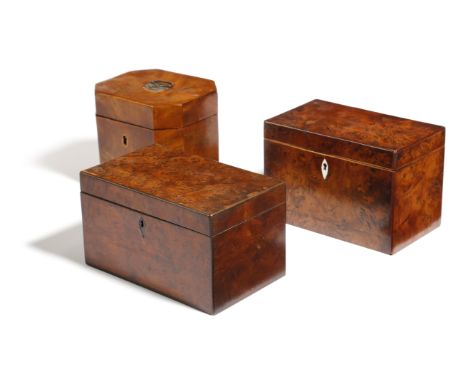Two George III burr yew rectangular tea caddies, the interiors both with twin divisions, one with lids, together with a mahog