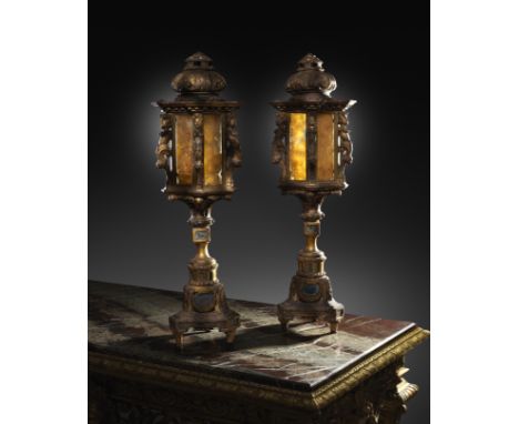 A pair of Italian Venetian giltwood lanterns, with ebonised decoration, each with a shell carved domed top, above a hexagonal