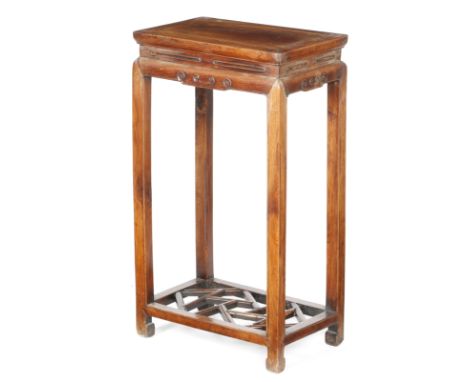 A Chinese elm jardiniere stand, with scroll decoration and a lattice base, Qing dynasty, 74.7cm high, 43.2cm wide, 26.5cm dee