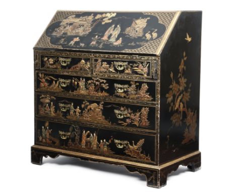 A black japanned bureau in 18th century style, polychrome and gilt decorated with chinoiserie scenes, the hinged fall reveali
