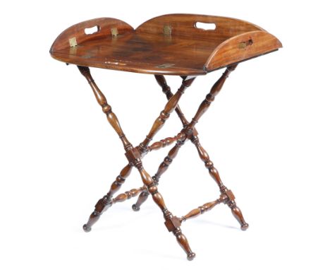 An early 19th century mahogany butler's tray on stand, with four hinged sides, each pierced with a handgrip, the folding stan
