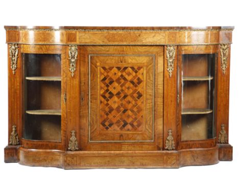 A Victorian walnut and parquetry breakfront credenza, with gilt brass mounts and tulipwood banding, with a panelled door encl