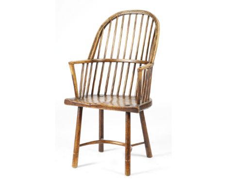 A George III Welsh ash stick-back Windsor style armchair, the bow back above a shaped elm bell-shaped seat, on turned legs un