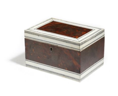 λ An early 19th century Anglo-Indian ivory and tortoiseshell tea caddy, lac decorated with guilloche bands, the hinged lid re