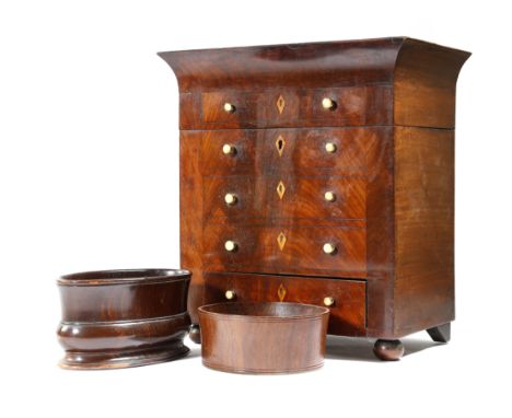 A mid-19th century continental miniature chest, the hinged top revealing a vacant lined interior, with four false front drawe