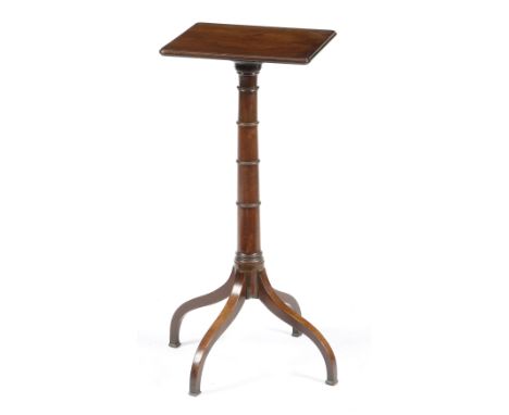 A Regency mahogany lamp stand, the top with a moulded edge on a ring turned column stem and four scroll legs, 70.7cm high, 41