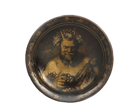 A Limoges enamel dish, decorated in gilt on a fond ιcaille (faux tortoiseshell) ground, with an outer band of grapevine, the 