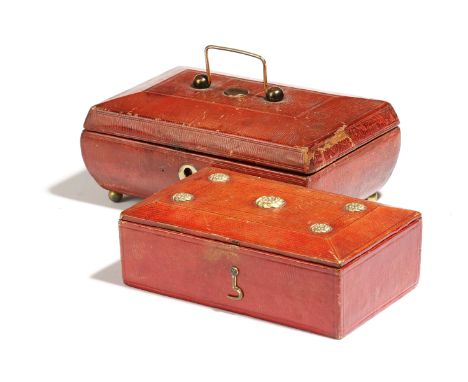 Two Regency red leather boxes, one of sarcophagus shape, the inside of the lid with a printed silk panel of a lady on a chari
