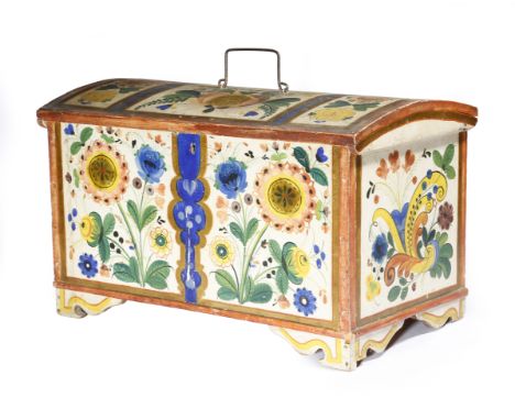 A Norwegian folk art painted pine trunk, decorated all over with panels of flowers, the domed lid with an iron handle, reveal