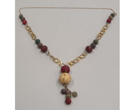 Long carved ruby emerald &amp; sapphire necklace on gold metal mounts. Tests as silver gilt. 