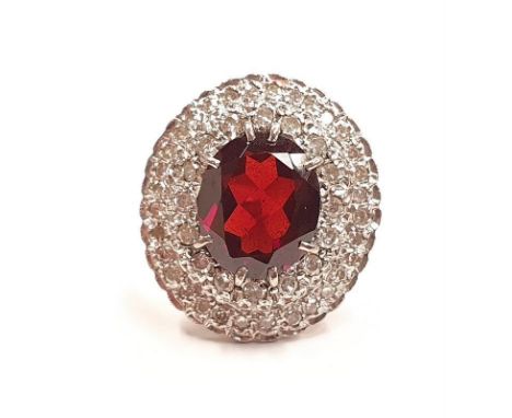 A very substantial 18ct yellow gold garnet and diamond cluster ring. Central stone 6cts approx. Size O. 