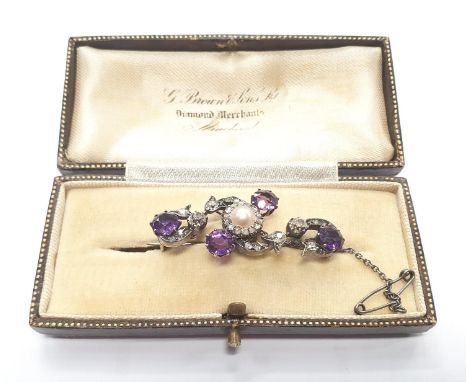 A Victorian gold on silver ladies diamond amethyst pearl brooch in its original fitted box with safety chain. Approx 0.5ct di