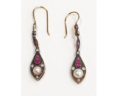 A pair of gold and silver ruby diamond and pearl drop earrings. 