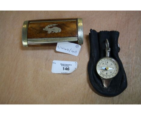 French plated rosewood snuff box worded La Jurassienne and a rocket compass