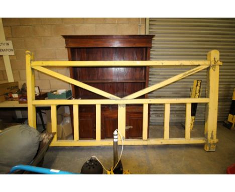 Large yellow painted pine gate