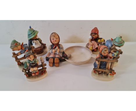 Seven Goebel Hummel figures.
