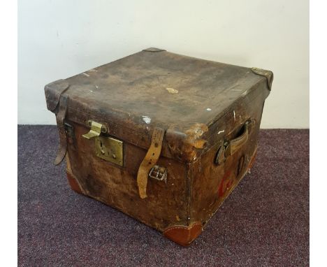 An Allen brown leather square trunk with brass lock.