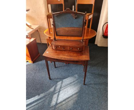 A 19th century mahogany side table with a mahogany two drawer swing mirror.