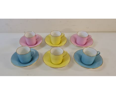 A set of six Shelley coffee cups and saucers yellow pink and blue.
