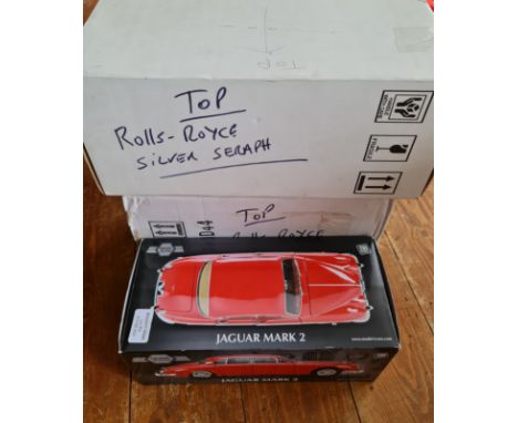Three boxed model cars two Rolls Royce and one Jaguar mark 2.