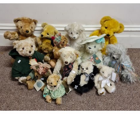 A collection of thirteen teddy bears to include Merrt Thought and one Steiff.