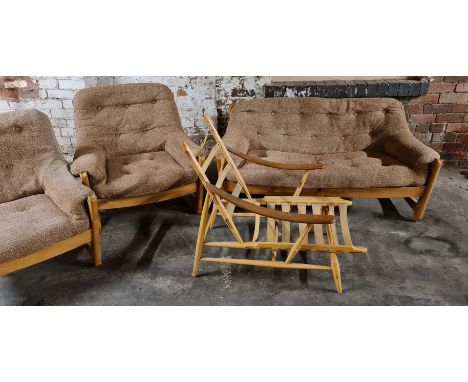 An Ercol two seater settee with two chairs and Ercol chair with no cushions.