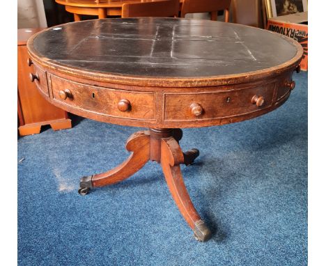 A 19th century mahogany rent table with leather finished top on a tripod base.