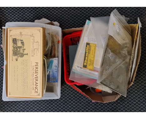 Two boxes containing mixed railway model accessories and battery chargers.