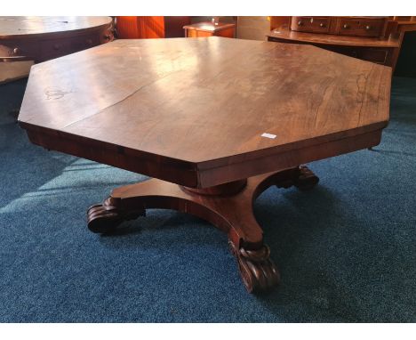 A 19th rosewood hexagonal tilt top dining table on single pedestal base.