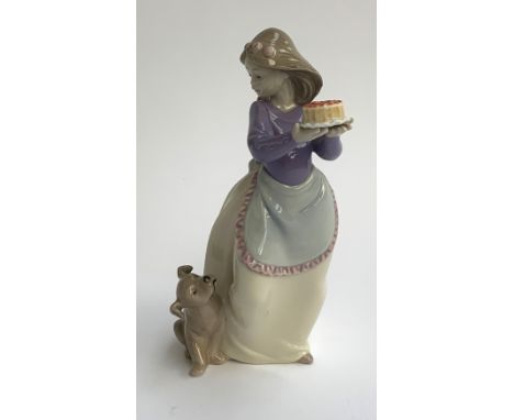A Nao figure of a girl with puppy and cake, 19cmH 