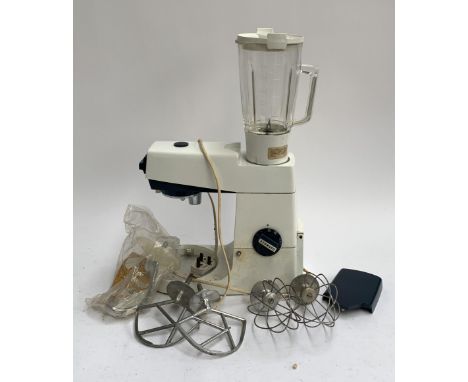 A vintage Kenwood mixer, with blender, two whisks, two 'Special K' mixers, a dough hook, and original cover 