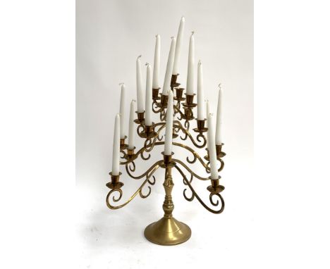 A 4 tier 17 arm brass candelabra with candles, 52cmH 
