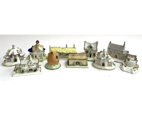 A lot of ten various Coalport ceramic cottages to include Wishing Well, Parasol House, The Crooked Cottage, Anne Hathaway's C
