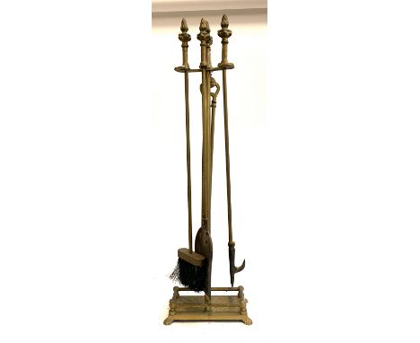 A set of brass fire tools with stand, 81cmH 