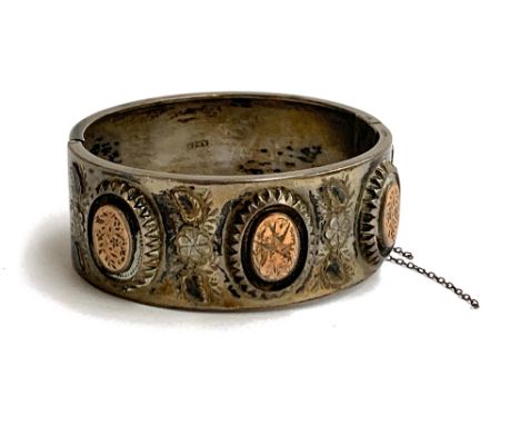 An 800. silver Aesthetic style bangle, hallmarked A&amp;JZ, approx. 31.7g 