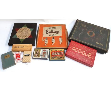 A mixed lot of games to include Philips bullion board, David Nixon magic box (af), Addique, draughts pieces, playing cards, d