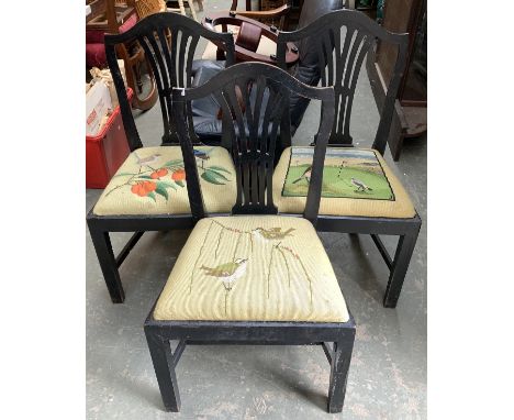 Three ebonised splatback dining chairs with drop in tapestry seats depicting songbirds 