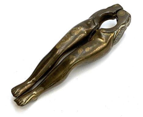 A late Victorian novelty brass nutcracker in the form of a pair of ladies legs, 12cmL 
