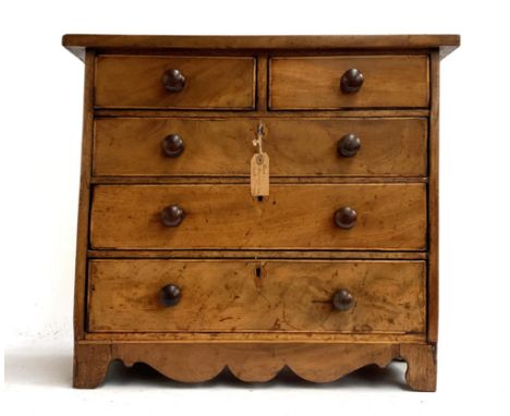 A small 19th century mahogany apprentice piece chest of two short over three long drawers, turned knobs, on bracket feet with