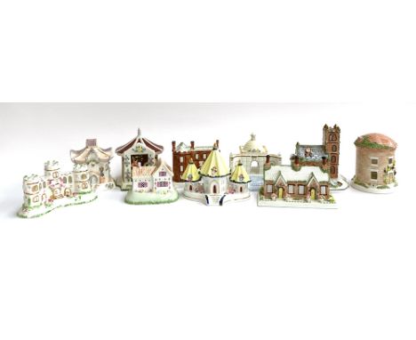 A lot of ten various Coalport ceramic cottages to include The Alms Houses, Village Church, The Cascade House at Chatsworth in
