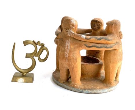 A Circle of Friends figure group, Mayan, pre-Columbian style 19cmH and a brass figure of the sacred spiritual symbol 'Om' 