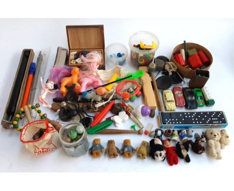 A mixed lot of toys and games to include mini Paddington teddy bears, marbles, building blocks, Matchbox, Corgi, Dinky cars, 