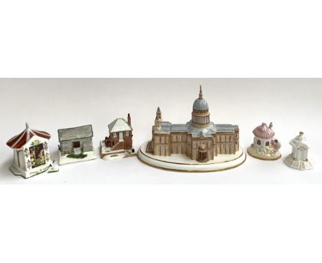 A Coalport limited edition 7/50 St Paul's Cathedral, 31cmL, together with several Coalport ceramic cottages (2 af) 