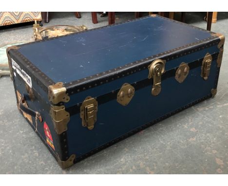 A travel trunk with stickers, 92x52x35cmH 