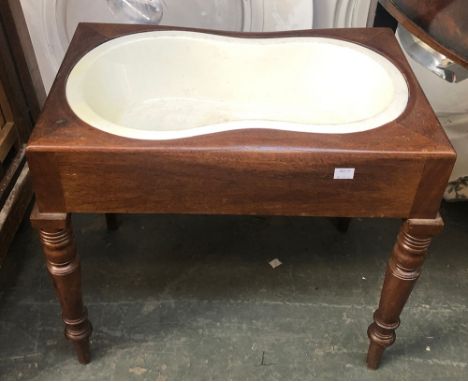 A 19th century mahogany commode, with ceramic liner, on turned legs, 53x36x46cmH 