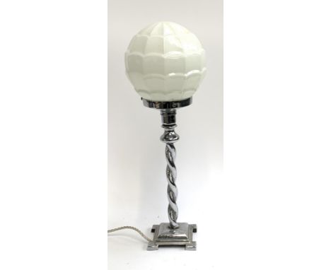 An art deco table lamp, later associated milk glass shade, on a chromed barley twist base 