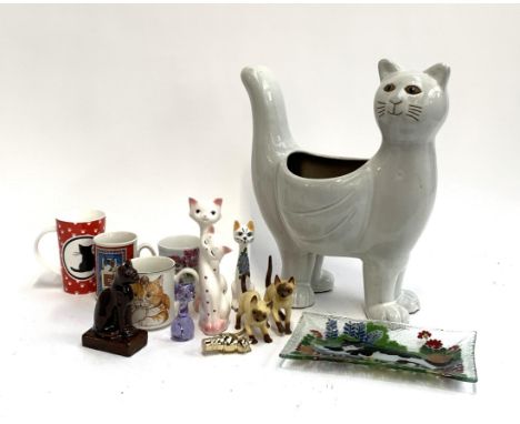 Cat Interest: A number of ceramic cat figurines, a large ceramic cat planter, 39cmH, several mugs 