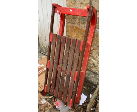 A red painted sled, 123cmL 