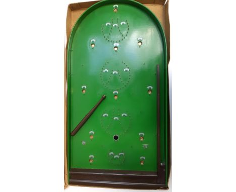 A Bagatelle board with balls and cue 